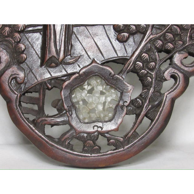 Chinese carved wood wall hanging panel, c.1950’s Hand carved with a central figure holding a fan, around which are four...