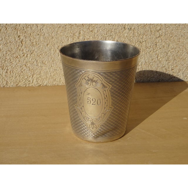 Silver-plated metal cup, a French-made christening gift by the silversmith Ercuis, late 19th century. Chased decoration...