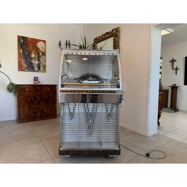 Rock-Ola Jukebox Model 1448 Dimensions: Height x Width x Depth 145 x 77 x 70 cm. Original Rock-Ola jukebox, model 1448, a...