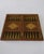 A one-of-one luxury chess and backgammon set crafted in Khatam marquetry, with a rich three-tone composition in black,...