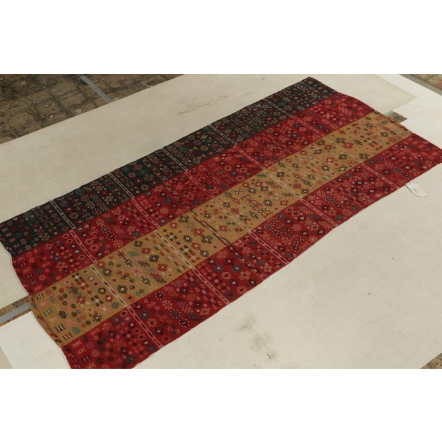 Handwoven in wool, an antique Verneh kilim rug originating from Russia circa 1920-1930, joining our coveted flat weave...
