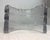 The Handmade Studio Glass Menorah by Joel & Candace Bless features a unique curved shape with a brutalist wave design,...