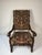 17th-century carved walnut armchair, Lombardy. This armchair features a high back and a spool structure, with legs and...