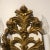 Pair of Hand carved wood sconce featuring a floral design with ribbon in a Vintaged gold gilt finish. Italy.