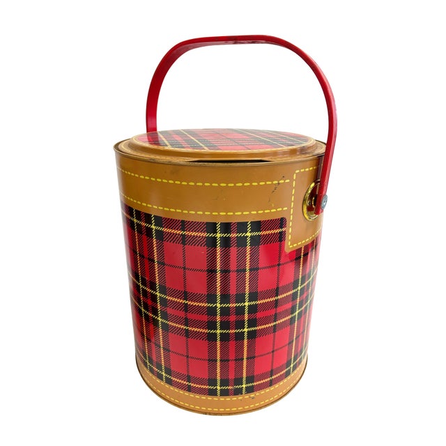 Three pieces of vintage picnicware. Two Skotch Kooler thermos' and a tin picnic basket.