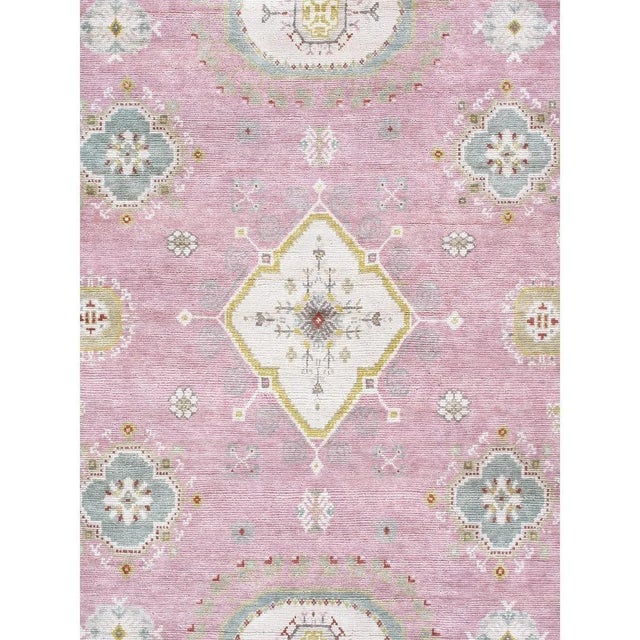 This exquisite Khotan rug is a masterpiece of traditional craftsmanship. Hand-knotted from 100% premium wool, it showcases...