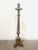 Antique Gothic-style or religious altar candlestick, likely constructed from cast brass or a similar dark metal. Design:...