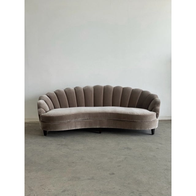 W94 D40 H32 SW77 SD20-23.5 SH18 This vintage curved sofa features a sculptural channel back design newly upholstered in...