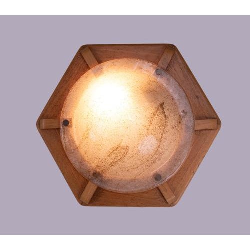 Modernist flush mount ceiling light executed in murano glass with brass finals on a wooden frame. Manufactured by kaiser...