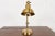 A classic Modern swing arm adjustable desk lamp or table lamp In the manner of Ralph Lauren India, Early 21st Century...