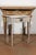 A Swedish small painted side table from the mid-19th century, with single drawer and turned legs. Born in Sweden during...