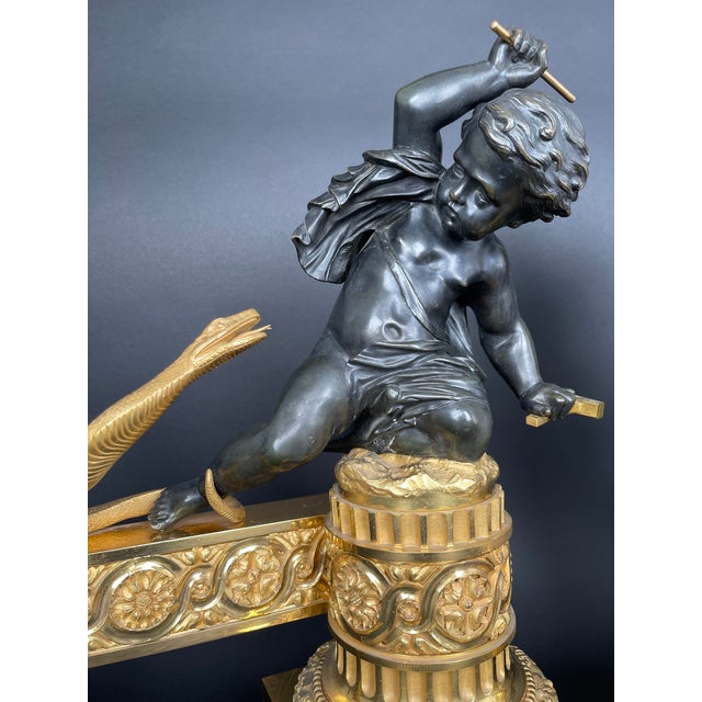 A Large Pair of Ormolu & Patinated Bronze Chenets by Henry Dasson The artist, Henry Masson, was a Parisian artisan known...