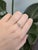 This minimalist 14K yellow gold ring features a dreamy round aquamarine from Brazil, flanked by tiny natural diamonds....