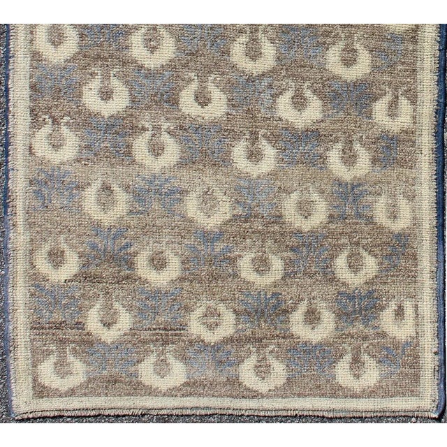 Measures: 2'9 x 6'6. Light brown, gray-blue, and cream Turkish Tulu vintage rug with latticework. Keivan Woven Arts / rug...