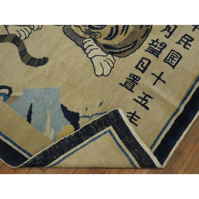 An early 20th-century fine quality mysterious Chinese tiger pictorial rug with symbolic Chinese elements, dated 1926. We...