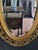 Early 1900s French Style Hand Carved Gilded Oval Beveled Wall Mirror For Sale - Image 11 of 12