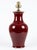 Fine quality Chinese porcelain Sang de Boeuf Oxblood Red lamp with fabric shade. Extraordinary glaze. This lamp is quite...