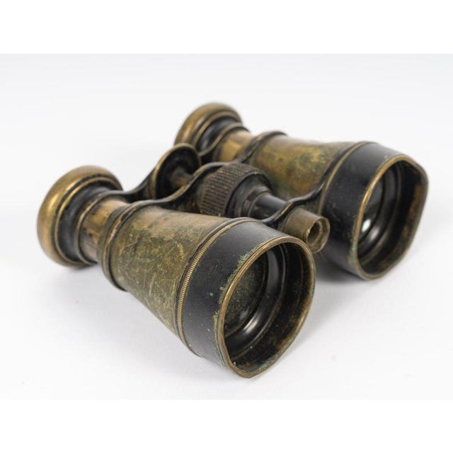 A pair of bronze binoculars, early 20th century. A pair of binoculars, inscribed ‘fournisseur de la guerre’, clermont, 114...