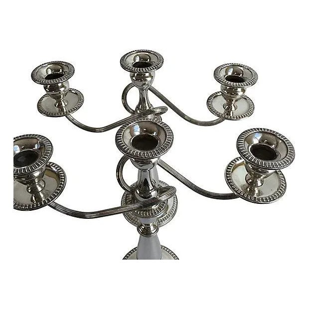 Pair of tall sterling silver three-arm candelabras that separate and can be used as two different size candlesticks. Each...