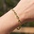 Elevate your everyday elegance with this exquisite gemstone station bracelet. Crafted with meticulous attention to detail,...