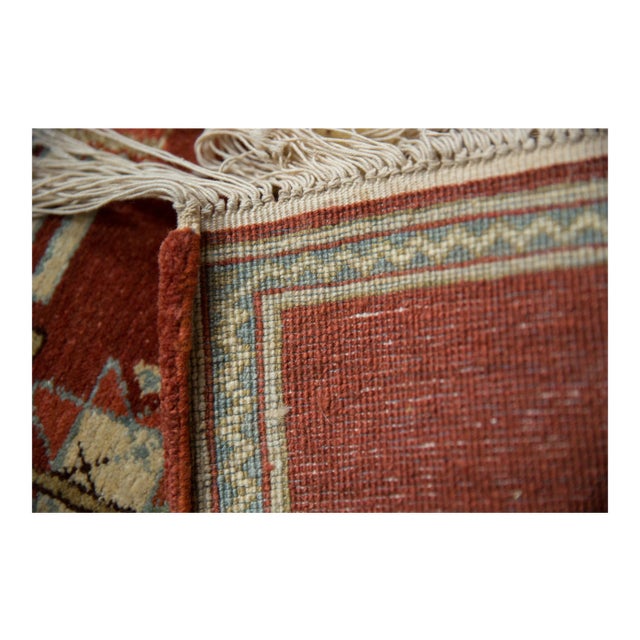 :: Herdsman on his horse leading two camels atop an abrashed field with simplistic primitive floral design elements...