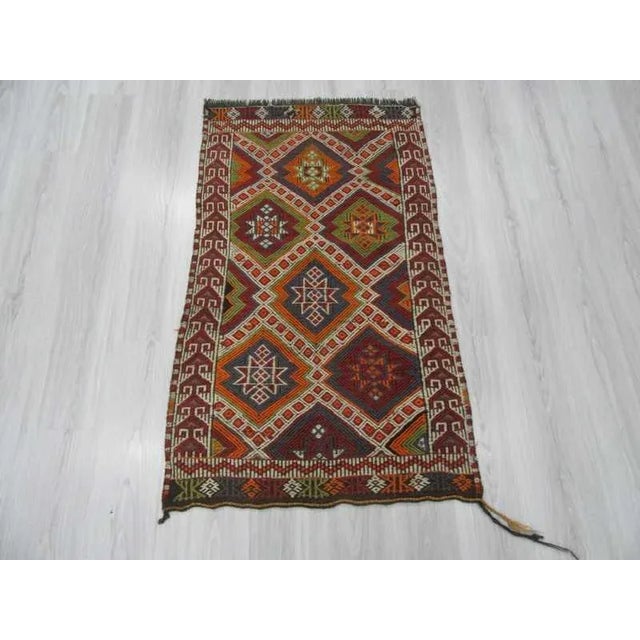 Vintage embroidered kilim rug from Mut region of Turkey. Approximately 30-40 years old. In very good condition.