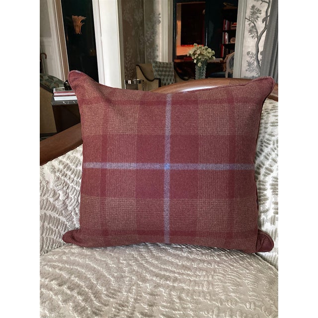 Italian virgin wool in burgundy is woven as a fine houndstooth check with a blue-gray overstripe on this 18-inch custom...