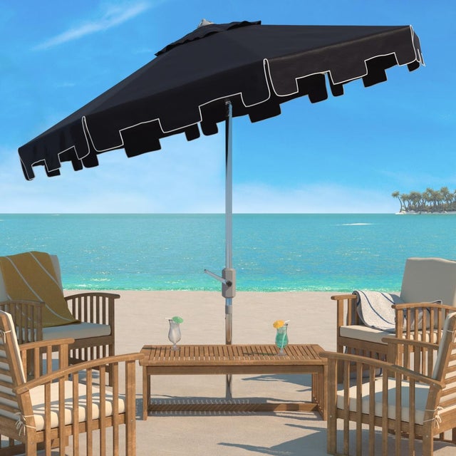 A classic market umbrella gets a chic makeover with fashion forward black fabric and a valance for extra sun protection...