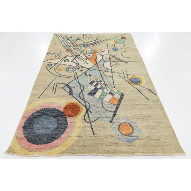 Elevate your living space with this modern 5x8 area rug, inspired by Wassily Kandinsky's bold geometric abstractions....