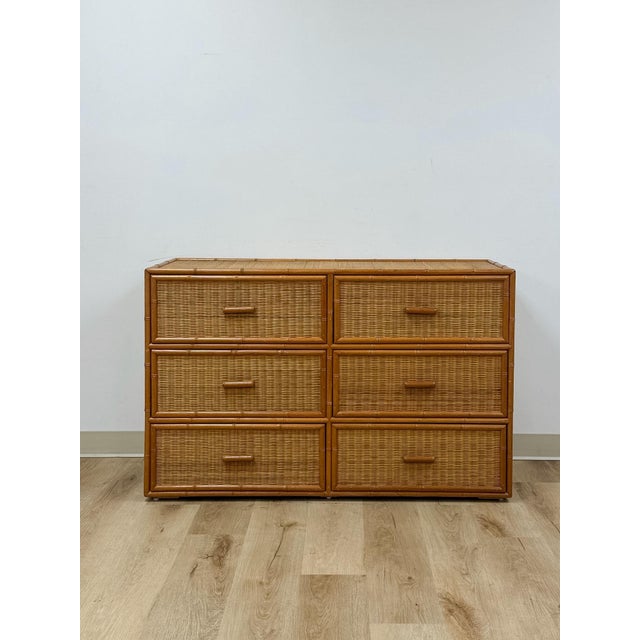 This vintage six-drawer dreasser brings an easy, coastal sensibility to bedroom storage, combining faux bamboo framing...