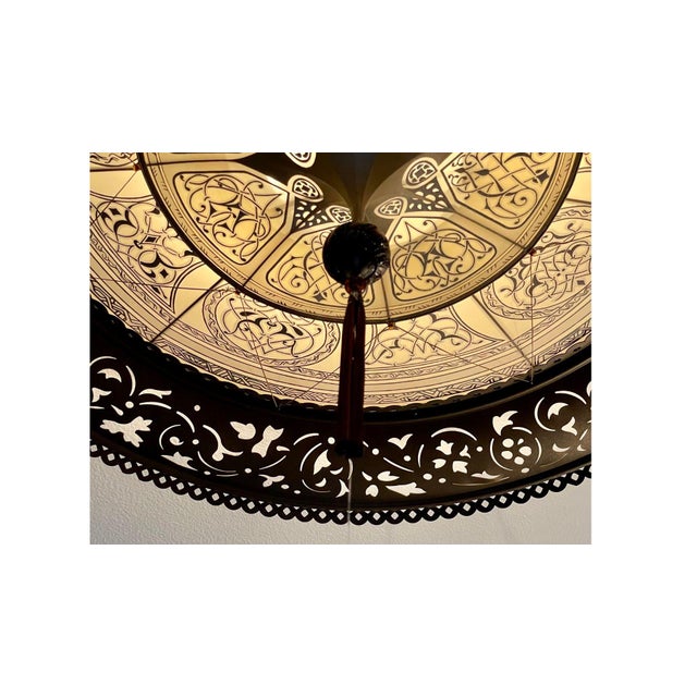 This elegant and handsome Fortuny® Scheherazade silk chandelier with bronze metal ring by Mariano Fortuny combines the...