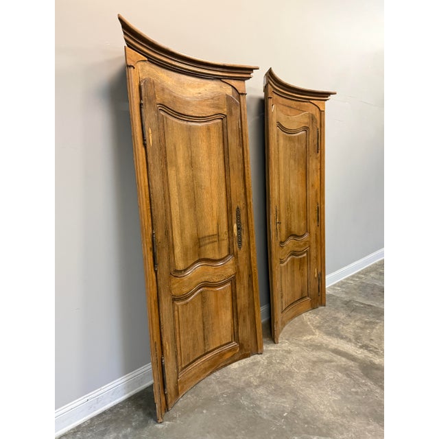 Pair of 19th C. French Louis XV style curved doors in oak featuring distinctive "Louis XV" style curves and intricate...