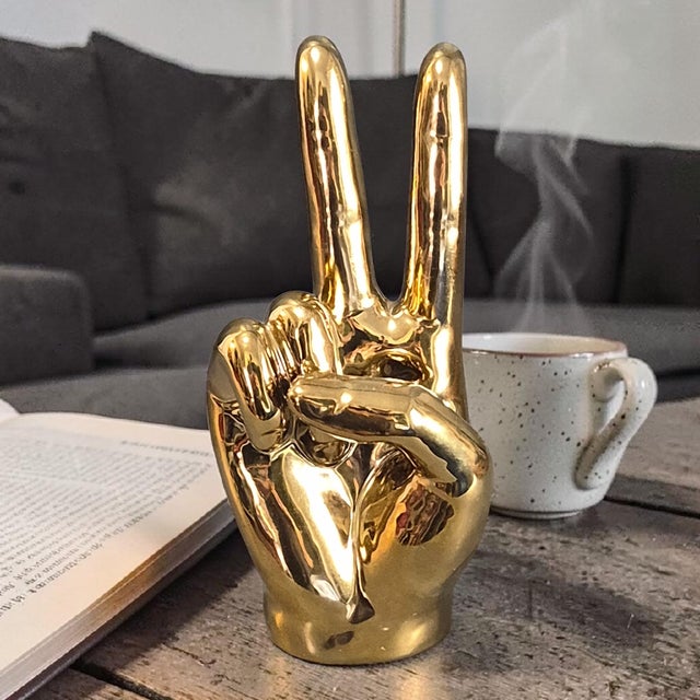 The Vintage Metallic Gold Coated Brass Peace Victory Hand Gesture sculpture is a unique and eye-catching piece of home...