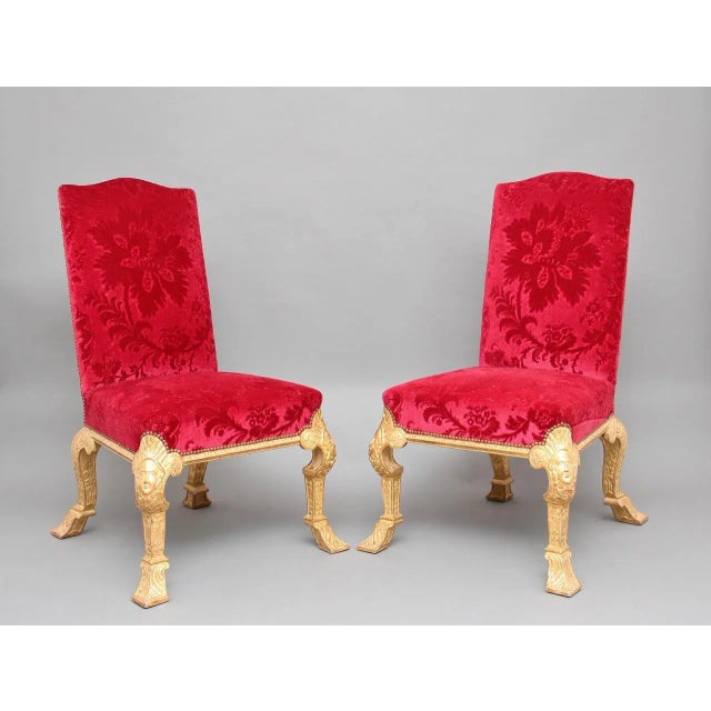This is a fabulous pair of early 20th-century carved and gilded chairs in the George Ist style. The front cabriole legs...