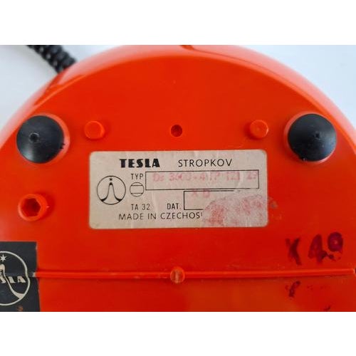 Midcentury rotary desk telephone manufactured by Tesla in Czechoslovakia during the 1970s. The telephone features a...