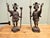Venetian Style Cast Brass Candlestick Figures A very unusual and stunning pair of table top cast brass candlesticks, the...