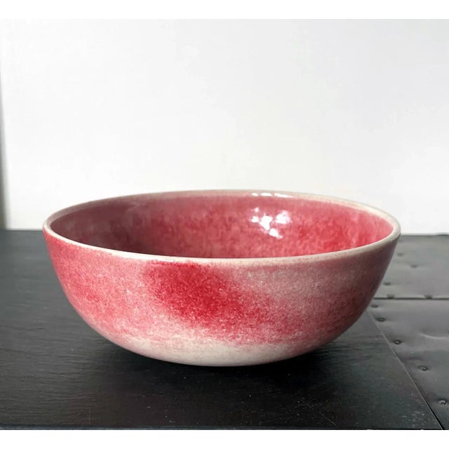 A ceramic round bowl with a flat foot ring studio crafted by Brother Thomas Bezanson (1929-2007) circa 1970-80s. Covered...