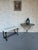 A vintage 1950s Spanish gilt iron bench with an elegant lyre-form base and hand-forged construction. The design features...