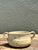 This vintage studio pottery bowl is a charming example of the 1970s organic craft movement, blending rustic warmth with...