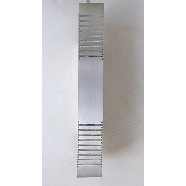 1960s European Space Age Mid Century Modern Sconce (3 available) in brushed aluminum. Square tubular form with cut-outs in...