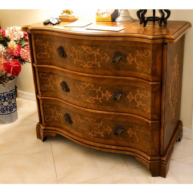 This elegant mid-20th century Italian inlaid French walnut Veronese style three-drawer chest was acquired more than 30...