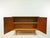 The sideboard is an original from the 60s. It consists of two elements. The box-shaped cabinet part stands on a trestle...