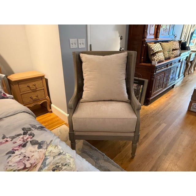 This French Provincial-inspired armchair blends rustic charm with refined sophistication. It features a hand-woven, wrap-...