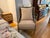 This French Provincial-inspired armchair blends rustic charm with refined sophistication. It features a hand-woven, wrap-...