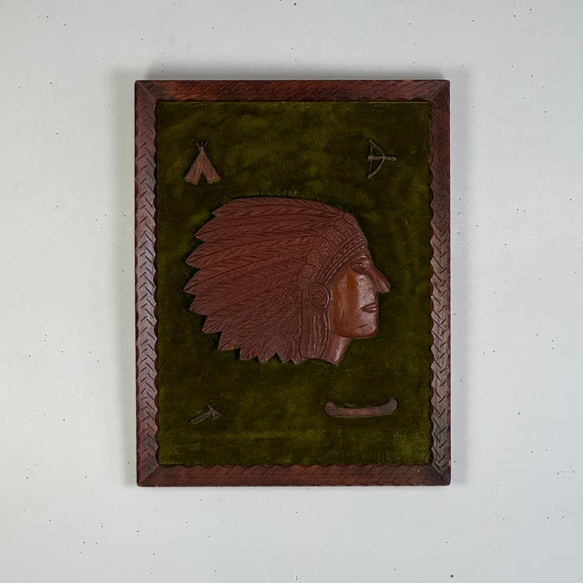 A unique and beautiful wooden carved collage pieces of a Native American tribal chief head bust with 4 emblems at each...