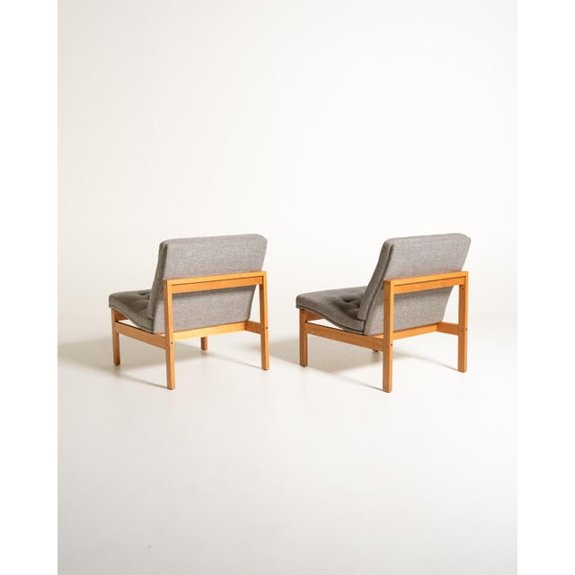 A pair of "Moduline" armchairs designed by Torben Lind and Ole Gjerløv-Knudsen and produced by France & Søn in the 1960s....