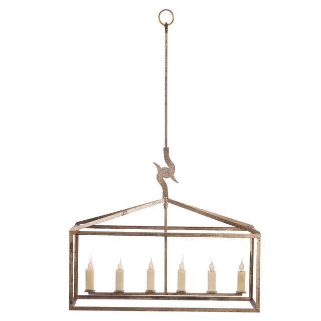 The Enlongated Box Hart Lantern in Old Gold finish with square candle covers in beeswax adds to Lowcountry flair with its...