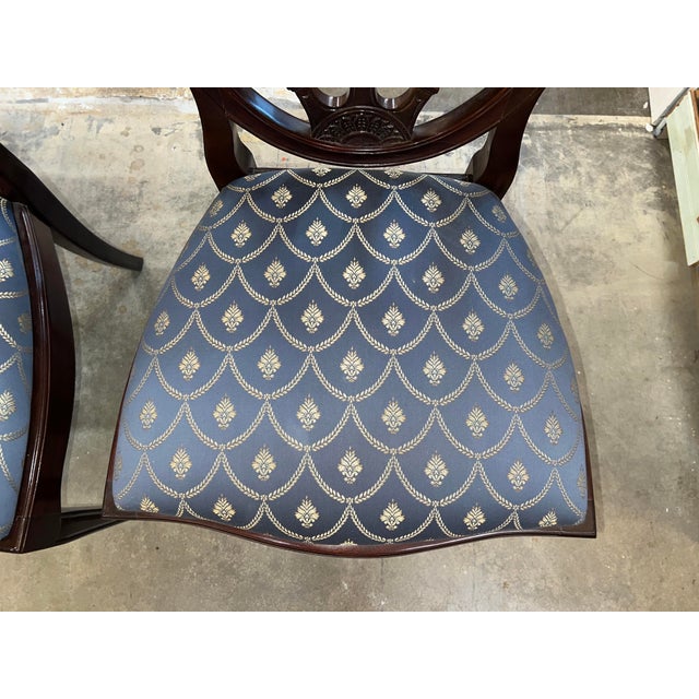 This is a beautiful set of 4 armless dining chairs with blue and gold jacquard upholstry fabric in excellent condition...