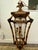 This vintage pagoda hanging lantern features an open, multi-tiered framework crafted in a faux-bamboo and rattan style....