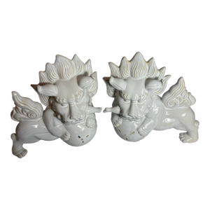 A Pair of Stylized Ceramic With White Glaze Chinese Foo Dogs